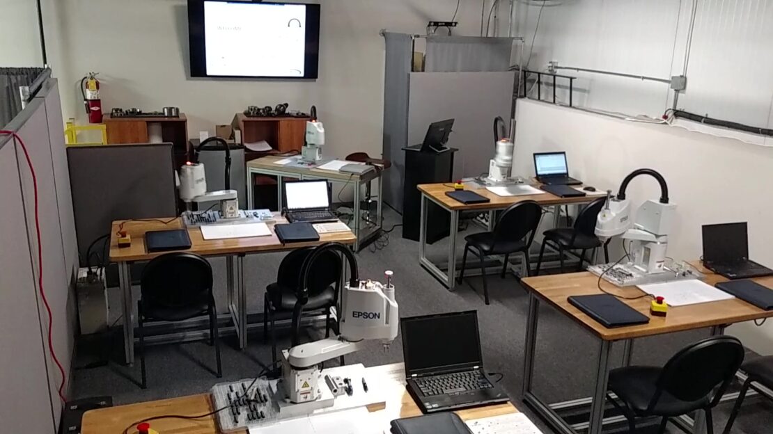 Training classroom at Schneider & company filled with EPSON six-axis robots and laptops