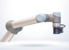 Schneider & Company - A sleek modern industrial robot arm with a gripper tool at the end against a clean, white background.